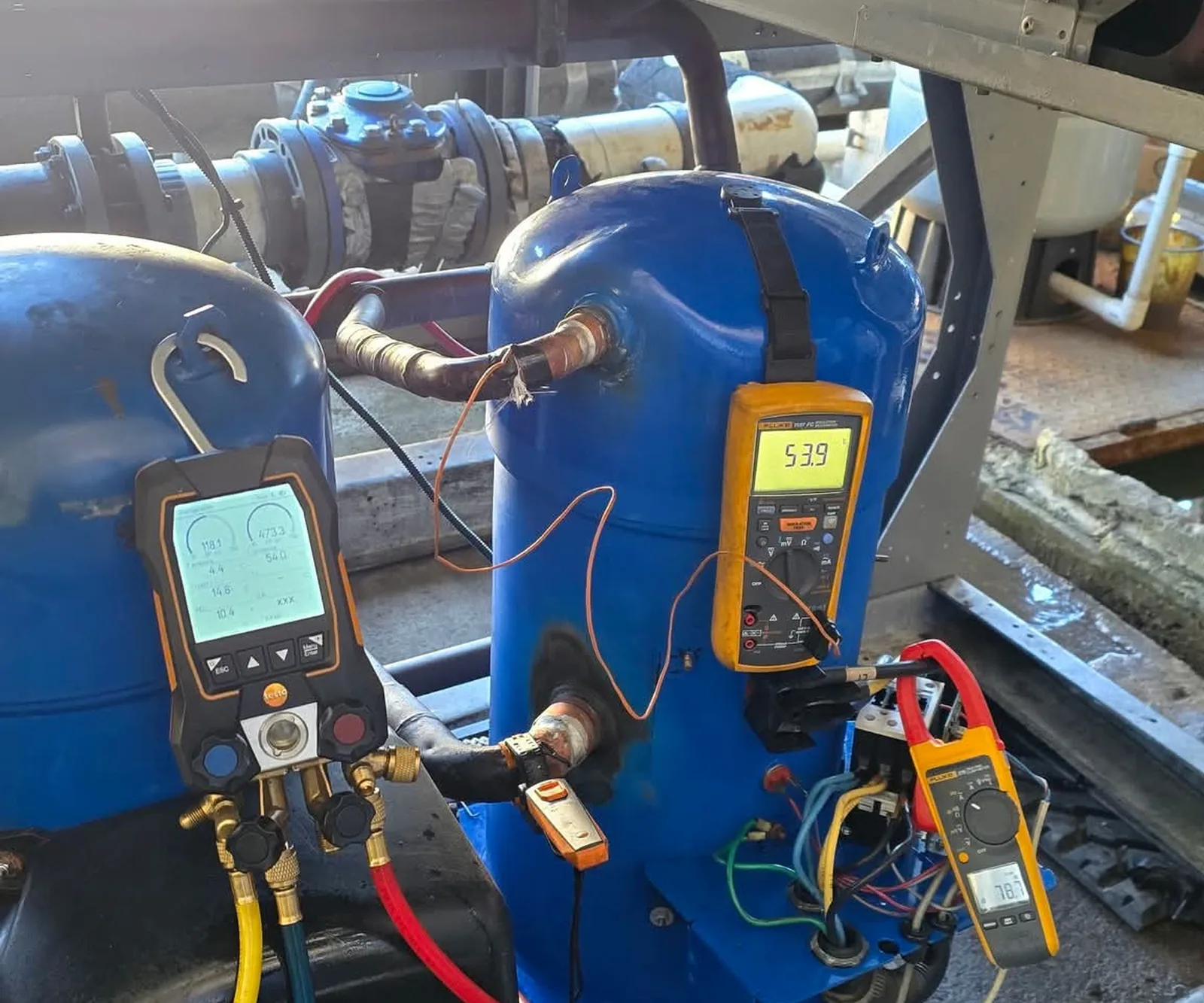 Refrigeration diagnostic equipment connected during a commercial service assessment